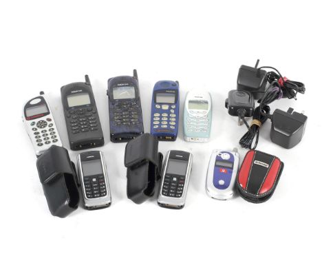 A collection of eight assorted vintage mobile phones. Including two Nokia, NHE-4NX, 5110, 3410, two 6021 and two Nokia charge