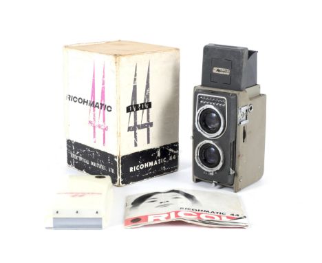 A Ricoh Ricohmatic 4x4 TLR camera. With a 60mm 1:3.5 lens. In original packaging Condition Report: The light-meter does not a