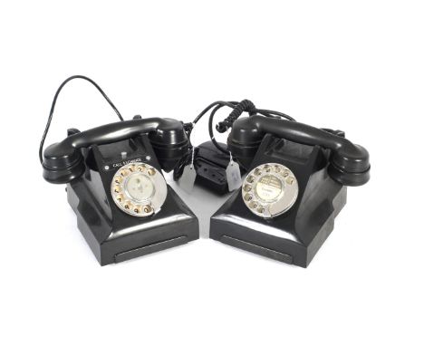 Two GPO 332F rotary black Bakelite telephones. One with 'Call exchange' button, both with handset 164