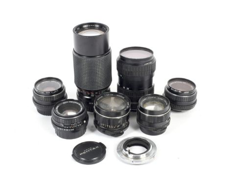 Seven Asahi Pentax and Asahi Pentax fit lenses and a Canon to Pentax KM lens adaptor. Lenses include three 50mm 1:2 SMC Penta