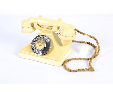 A GPO cream Bakelite rotary dial telephone 234. With matching hand set No 164 PL38 converted with modern telephone plug. 