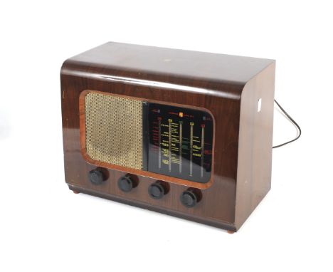 A mid-20th Century PYE Cambridge Type P45 valve radio receiver. S/n 0212128, in a veneered wooden case stamped #1164, with fo
