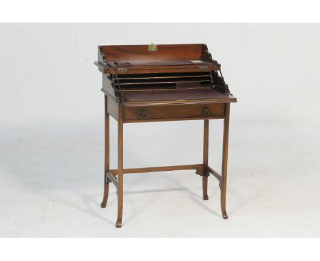 Late Victorian lady's mahogany writing table, the rectangular top with boxwood and ebony chequer line inlays opening to revea