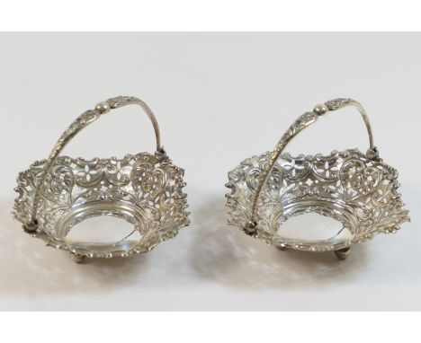 Pair of late Victorian silver bonbon dishes, Birmingham 1895, each of shaped square form pierced with C-scrolls and with swin