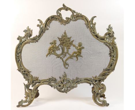 French cast brass firescreen, in Rococo Revival style, circa 1900, with winged cherubs (centred on a gauze) fanning a brazier