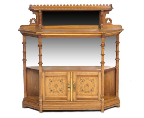 Victorian Gothic Revival satinwood chiffonier, circa 1875, having an upper shelf with mirrored back over a larger shelf, inla