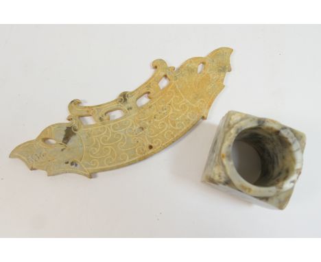 Chinese carved jadeite huang pendant, arched form terminating in dragon heads at both ends, incised with lappet scales, pierc