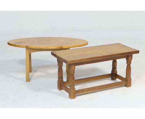 Oak coffee table in the style of Mouseman, the adzed rectangular top supported on tapered octagonal legs united by stretchers