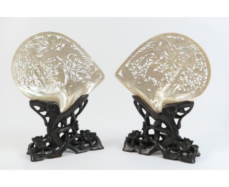 Pair of Eastern mother of pearl carved shell table screens, each worked with a scrolling dragon chasing a pearl amidst clouds