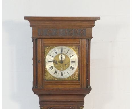 Oak eight day longcase clock, having a carved case, the hood initialled and dated 1898, brass 11 1/2'' dial signed Hampson, W