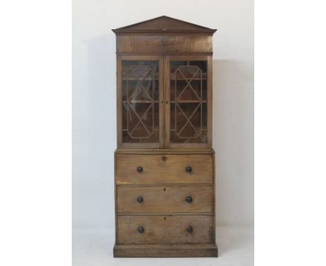 Late Georgian mahogany secretaire bookcase, circa 1820, having an architectural pediment over two astragal glazed doors openi