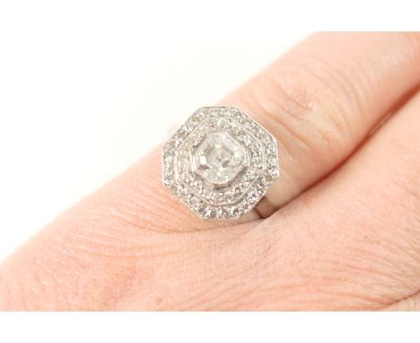 Attractive diamond cluster ring, circa 1920, central old step cut diamond of approx. 0.5ct estimated as H or J in colour and 