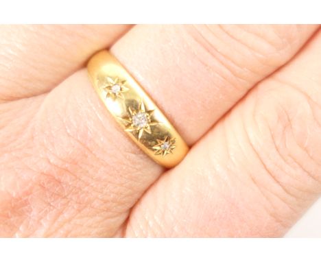 Edwardian diamond three stone gypsy ring, circa 1910, set with three tiny old cut diamonds, set in illusion star mounts, size