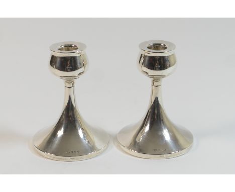 Pair of Pair of George VI silver dwarf candlesticks, maker WA, Birmingham 1949, in a modernist style, with a wide weighted tr