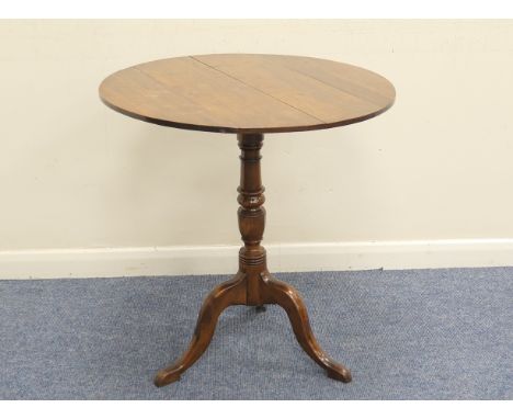 Mahogany and yewood tilt top tripod table, the circular top over a turned yewood column and three yew cabriole legs, 65cm dia