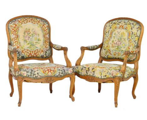 Pair of French oak fauteils, late 19th Century, tapestry upholstered back and seat detailed with floral bouquets in gross-poi