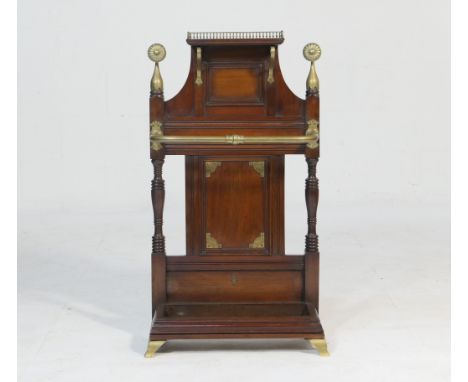 Attributed to James Shoolbred, a Victorian walnut and brass hall stand, having an upper shelf with brass three-quarter galler