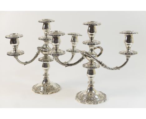 Pair of silver plated three branch candelabra, in Victorian style, worked throughout with floral decoration, height 33cm 