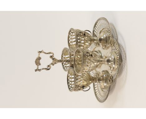 Victorian silver egg cruet, by George Fox, London 1862, the lobed, pierced square base supporting four egg cups with lions ma
