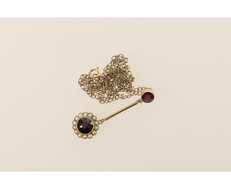 Edwardian garnet and pearl pendant necklace, having a round cut garnet within a bead collet mount bordered with seed pearls i