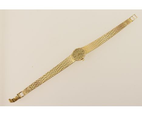 Longines lady's 9ct gold bracelet wristwatch, signed oval gilt 16mm dial with baton numerals, manual wind movement, on an int