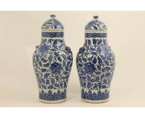 Pair Chinese blue and white lidded vases in Ming style, 18th Century, each having a domed cover with pomegranate finial over 