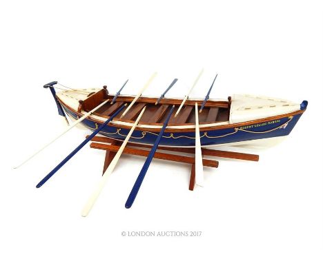 A 1960's painted wooden model lifeboat on stand, made by a fisherman, marked 'Whitby No2 Life-Boat' and 'Robert & Ellen Robso