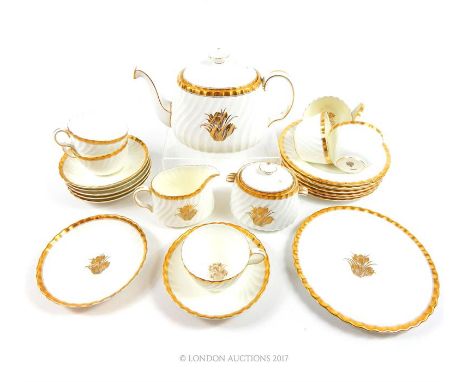 A Minton bone china tea set to seat seven, including tea pot (restoration to handle), jug, sugar bowl, cups, saucers and side