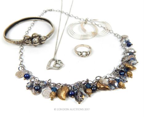Two silver necklaces, with a pair of hoop earrings a ring and a bangle.