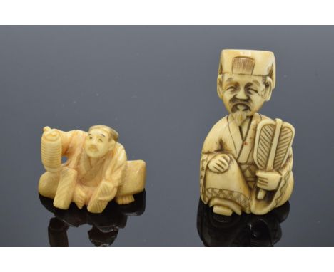 A pair of vintage bone (or similar) Japanese netsukes. 6cm tallest. 