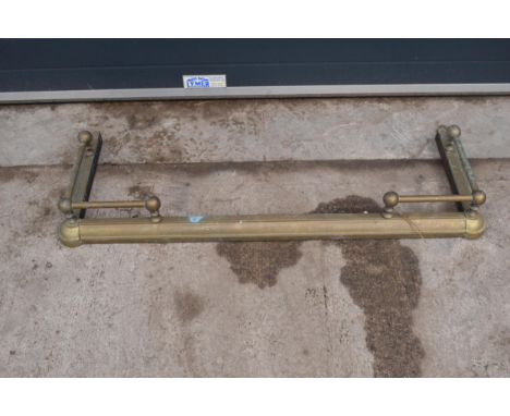 A brass and metal fire fender. 122cm long. 