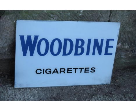 A vintage glass advertising sign of rectangular form for Woodbine Cigarettes. 60 x 40cm. No postage. 