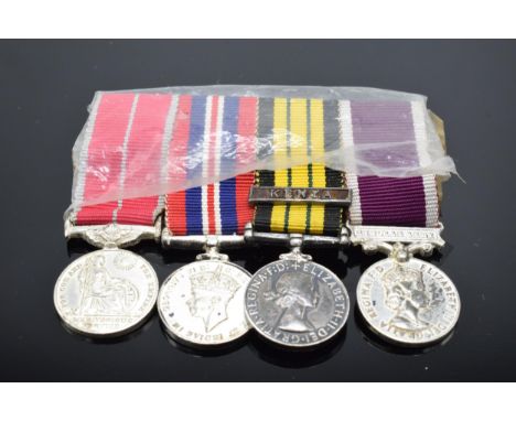 A set of 4 miniature medals with ribbons to include Queen Elizabeth Kenya medal, QEII Regular Army medal, George VI 1939-45 m