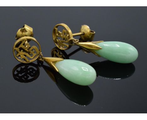 A pair of 14ct gold earrings with jade (or similar hardstone) stone. Stamped 14k and tests as 14ct. 4.1 grams. 