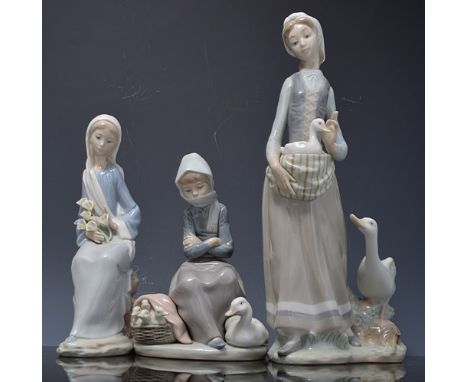 Lladro figure of a girl with a goose and a duck, 33cms and three other Lladro figurines, (4).