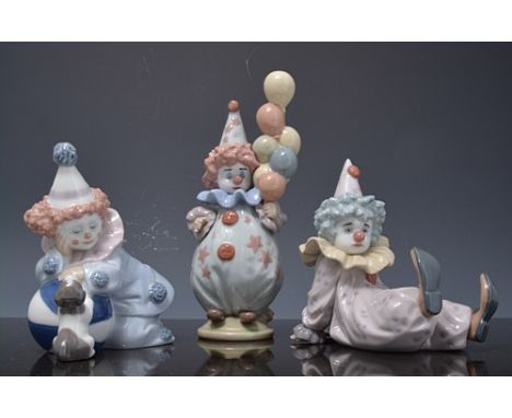 Lladro figure of a clown with balloons, 15cms and two other Lladro models of clowns, each boxed, (3).