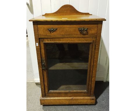 Oak cabinet with glazed doors and single shelf, with drawer above.