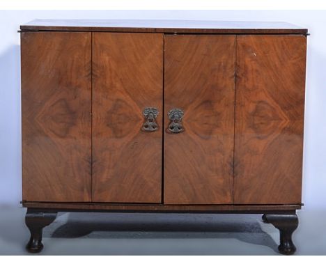 Walnut bow-front record cabinet, with double hinged doors, width 67cms and a collection of LP records.