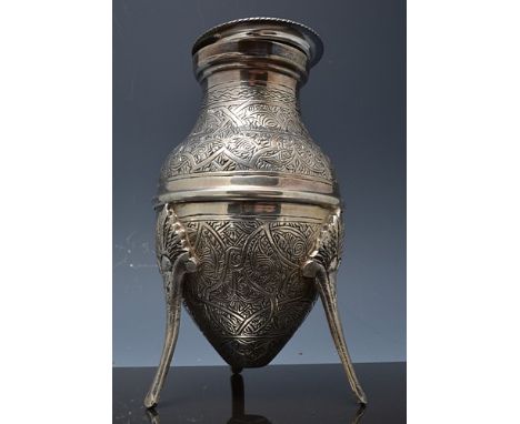 Persian white metal urn shaped vase with a flat lid, chase floral decoration, tripod legs, indistinctly marked to legs. 15cm.