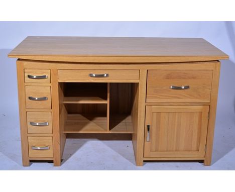 Modern light oak twin pedestal desk, rectangular top, fitted with a single kneehole drawers, over recessed shelves, the pedes