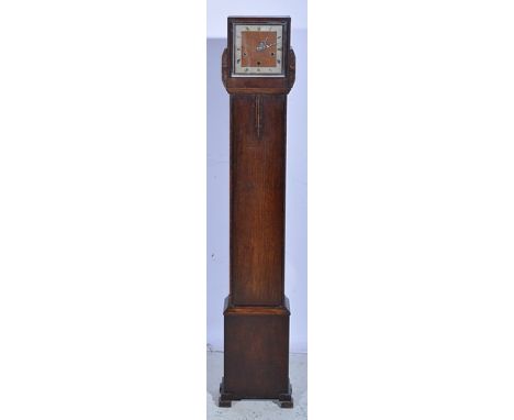 Oak-cased grandmother clock, square silvered chapter ring, movement striking on eight gongs, 140cms.