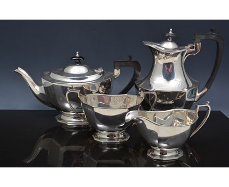 Three piece silver tea set, Sheffield 1933, rectangular pedestal form with canted corners, teapot with composition handle and