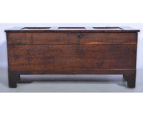 Part boarded oak coffer, in part late 18th Century, three-panel lid, bracket feet, width 111cms.