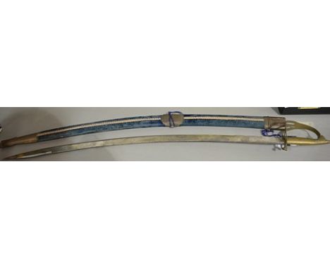 Indian sabre, 28cm curved steel blade, brass hilt with a lion mask, in a velvet covered scabbard.