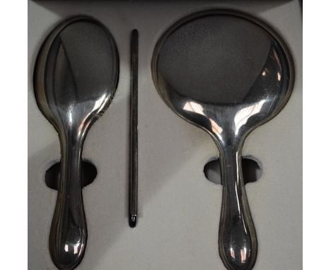 Modern silver three-piece dressing table set, by Carr's of Sheffield, cased and a compact.