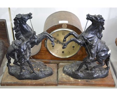 Pair of painted spelter models of Marly Horses, on wooden bases, 33cms  an oak-cased mantel clock, and a door stop (4).
