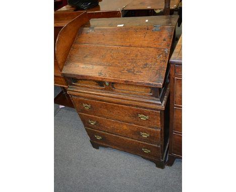 Old oak bureau on chest, slope front boarded bureau, enclosed a fitted interior with a shelf, pigeon hole and drawers, (one m