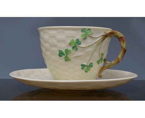 Belleek tea ware, basket weave moulded and decorated with shamrocks, two Belleek mugs, basin, etc., together with a book, "Be