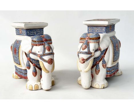 ELEPHANT STOOLS, a pair, Chinese ceramic modelled as ceremonial elephants, 45cm H x 55cm W x 25cm D. (2) 