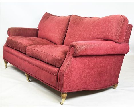 SOFA, George Smith style upholstered in raspberry chenille, raised on turned front supports and brass castors, 200cm W, 